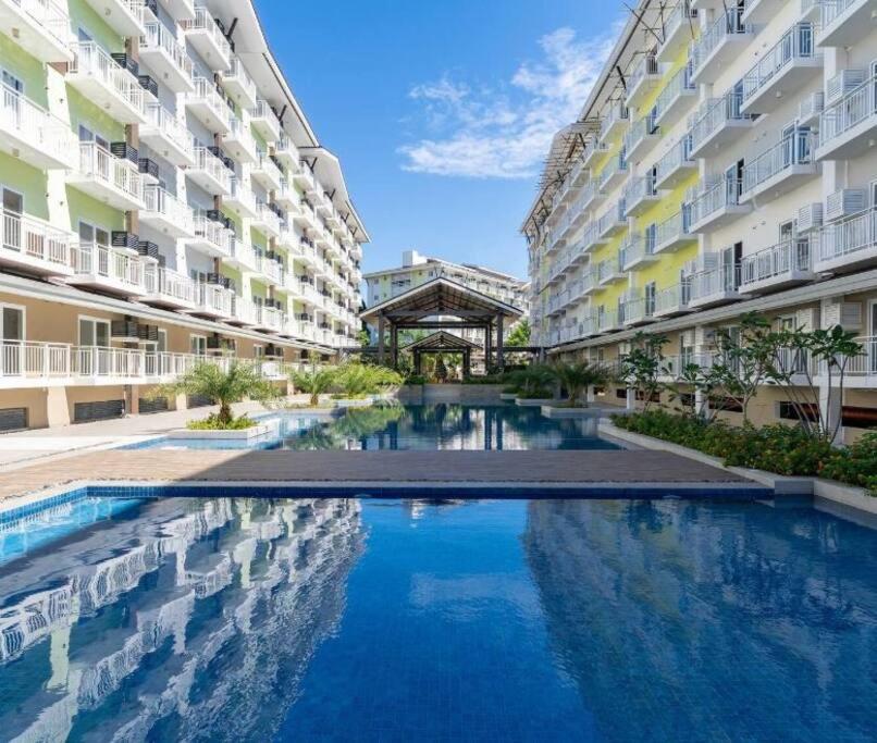 212B Amani Grand Resort Residences near to Airport with pool, gym, wifi, netflix