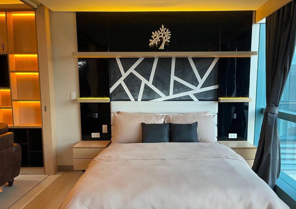Escape 1BR One Uptown BGC w/ Sound System