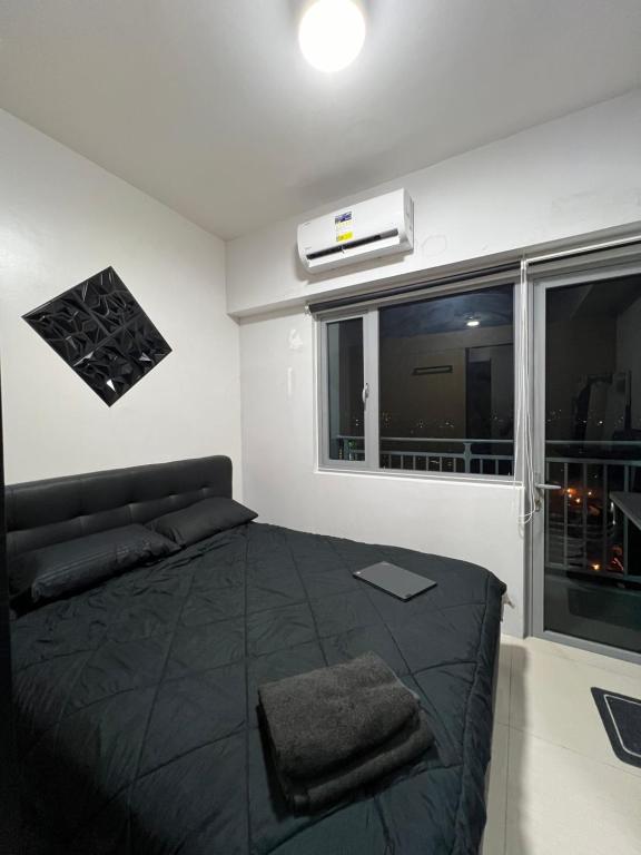 1BR Condo with Lazy Boy and Videoke in Grass Residences at SM North Edsa